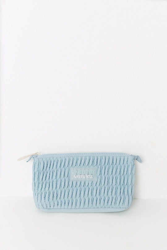 Medium blue quilted toiletry bag